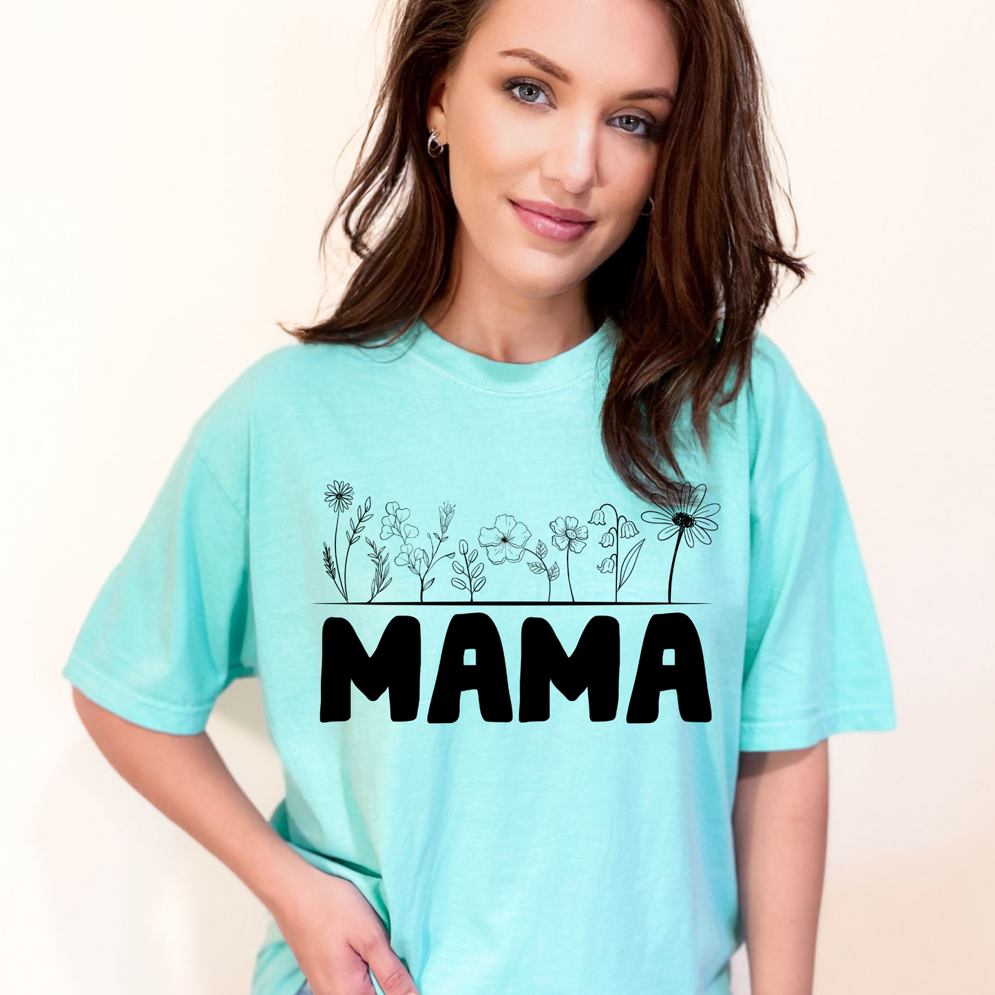 Woman wearing a t-shirt that says MAMA.